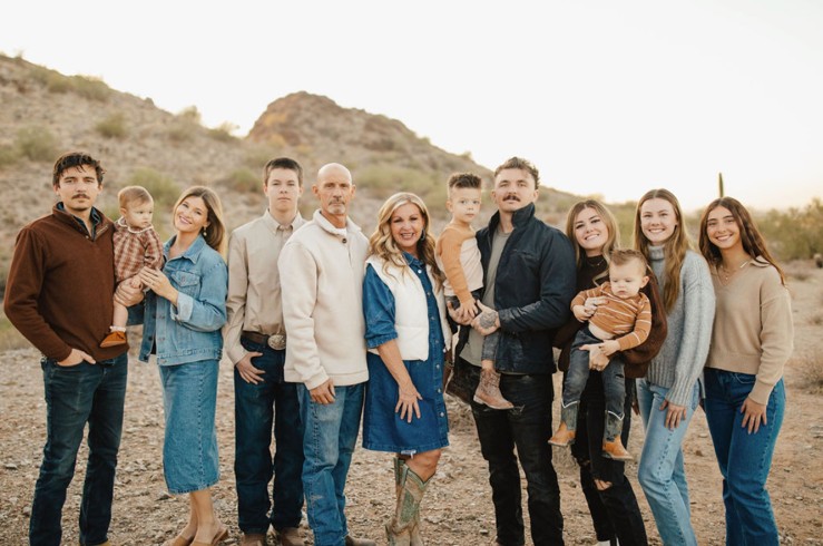 Ron Sericati, owner of Sonoran Athletic Court Builders, with his family in the Arizona desert near Mesa